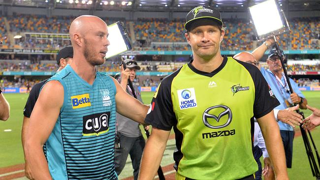 Brisbane Heat captain Chris Lynn (left) and Sydney Thunder skipper Shane Watson after Thursday night’s match at the Gabba was declared a no-result. Picture: Getty Images