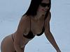 Kendall Jenner frolics in the snow in a tiny bikini.