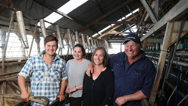 Still growing: Dairy farmers Mick &amp; Paula Hughes, and their kids Robbie, 17, and Jorja, 13, at their Inverloch farm. The couple switched to one-a-day milking two years ago.