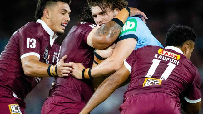 Queensland defenders swarm all over Angus Crichton.