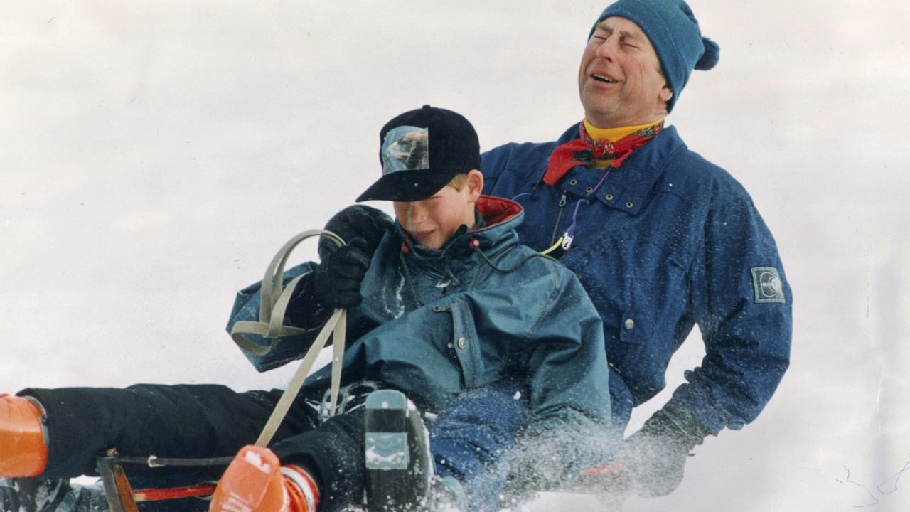 Sledging in Klosters with Prince Harry. Prince Charles, who had a bad back, winces in agony when their sledge struck a mogul. Picture Arthur Edwards