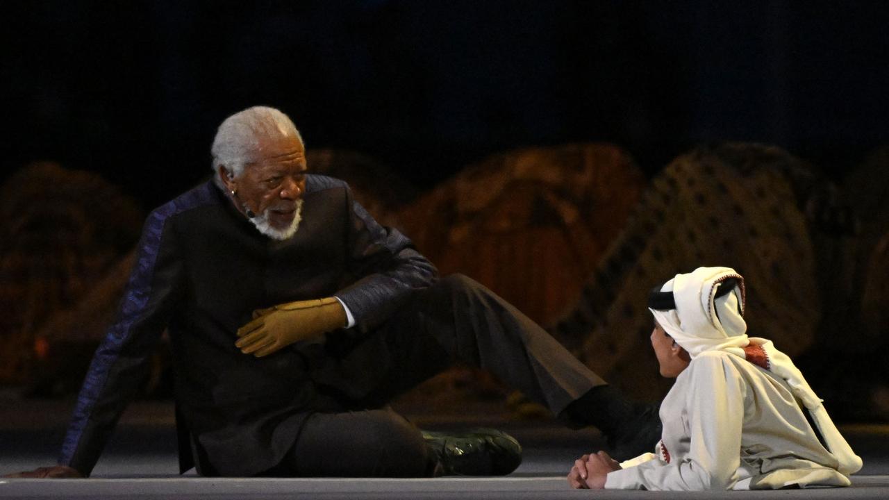 US actor Morgan Freeman (L) and Qatari YouTuber Ghanim al-Muftah speak during the opening ceremony of the Qatar 2022 World Cup Group A football match between Qatar and Ecuador at the Al-Bayt Stadium in Al Khor, north of Doha, on November 20, 2022. (Photo by Raul ARBOLEDA / AFP)