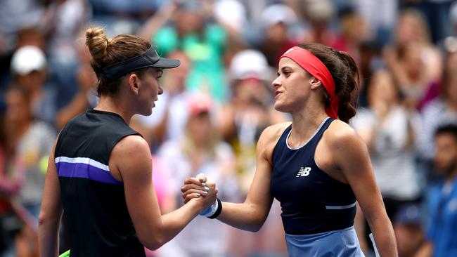 Respect ... Simona Halep (left) and Nicole Gibbs shake hands following the US Open first round clash. Picture: Getty Images