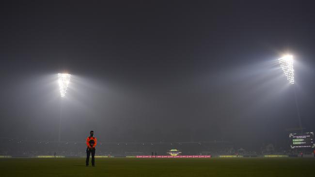 Smoke haze engulfed Manuka Oval, focing the players from the field in the Big Big clash between Sydney Thunder and Adelaide Strikers. Picture: AAP