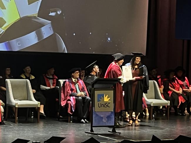 Graduates from the University of the Sunshine Coast's Fraser Coast campus celebrating at the Brolga Theatre.