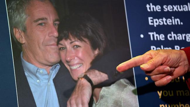 A photograph of Ghislaine Maxwell and Jeffrey Epstein is seen as acting US Attorney as charges against Maxwell are announced during a press conference in New York City in July. Picture: AFP