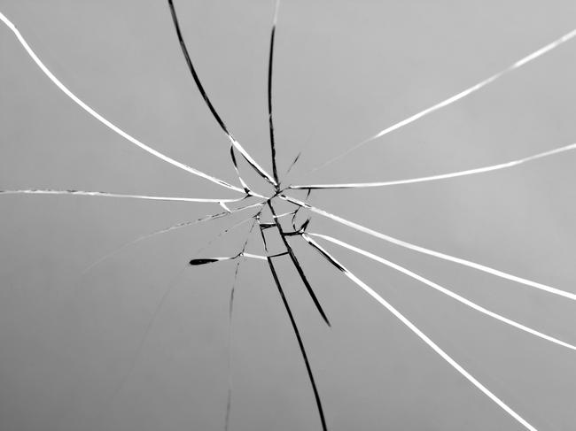 Broken and Shattered Glass Pane. Cracked. Mirror. Generic image.