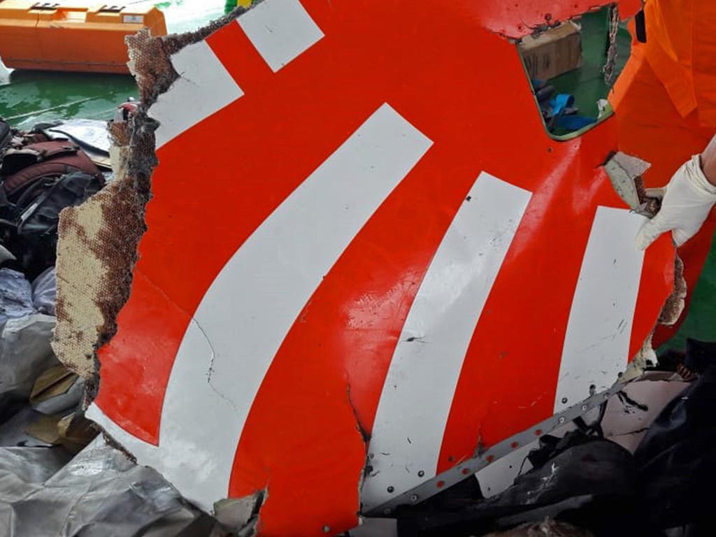 An image  and released by Indonesia's National Search And Rescue Agency shows rescue personnel displaying a piece of wreckage from Lion Air flight JT 610. Picture: AFP