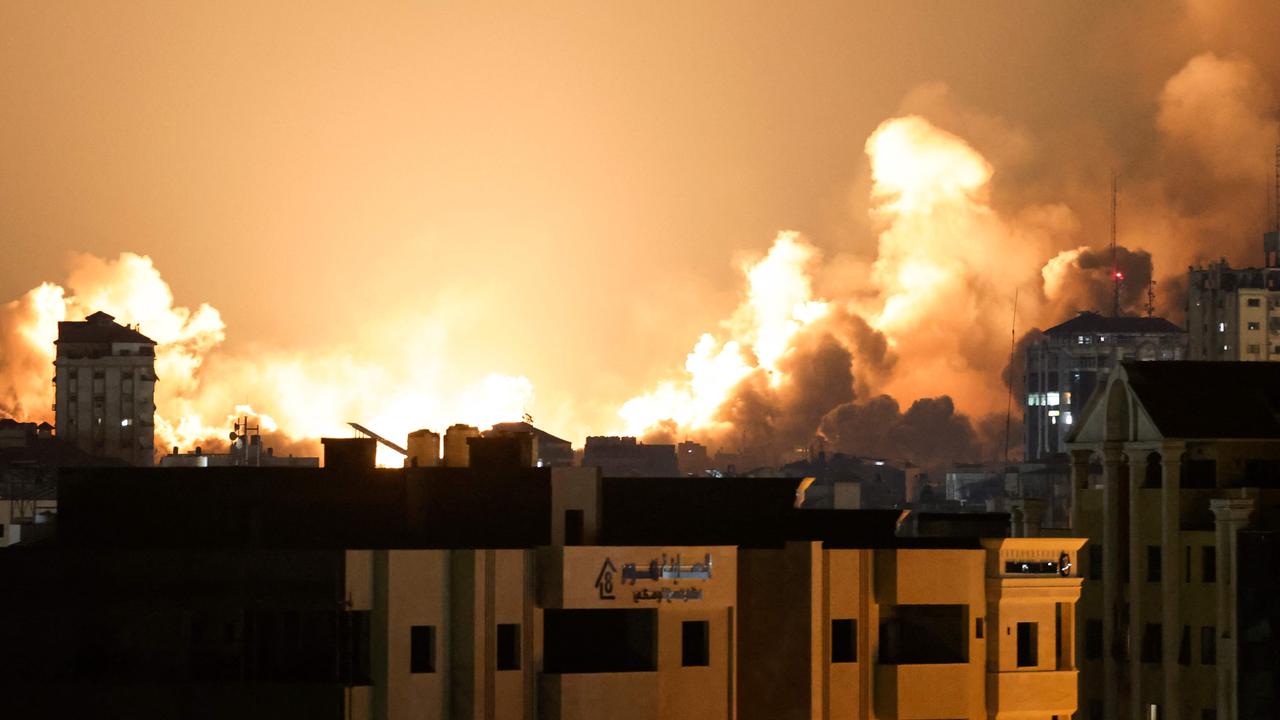 A plume of smoke rises above buildings in Gaza City during an Israeli air strike on October 8, 2023. Picture: AFP