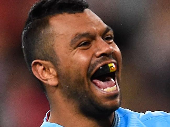 BRISBANE, AUSTRALIA - JULY 12: Kurtley Beale of the Waratahs celebrates after scoring a try during the round 19 Super Rugby match between the Reds and the Waratahs at Suncorp Stadium on July 12, 2014 in Brisbane, Australia. (Photo by Ian Hitchcock/Getty Images)