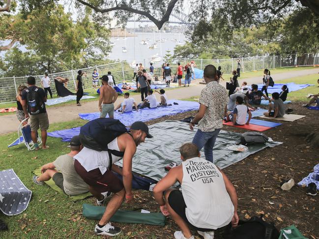 Crowds flock into Mrs Macquarie's Chair to claim positions for tonight's New Years Eve celebrations in Sydney. Picture: Dylan Robinson