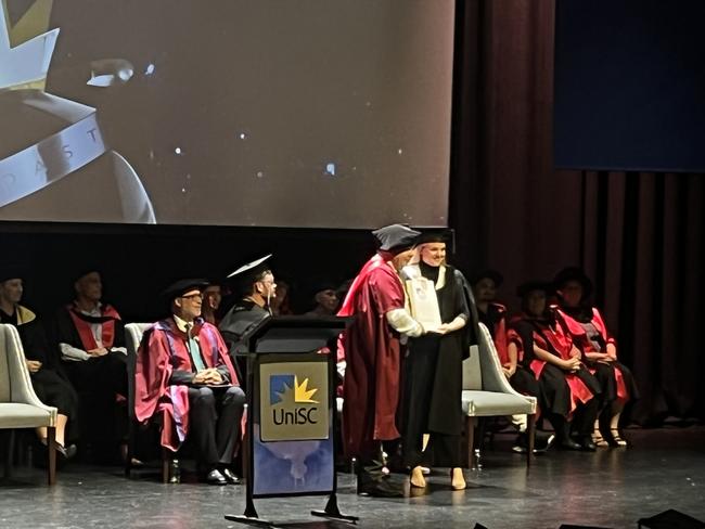 Graduates from the University of the Sunshine Coast's Fraser Coast campus celebrating at the Brolga Theatre.