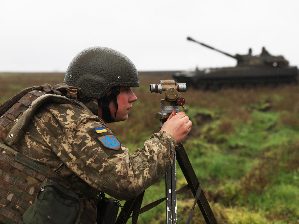 A Ukrainian soldier aims before a 2S1 Gvozdika tank fires a shell on the front line in Donetsk region. Picture: AFP