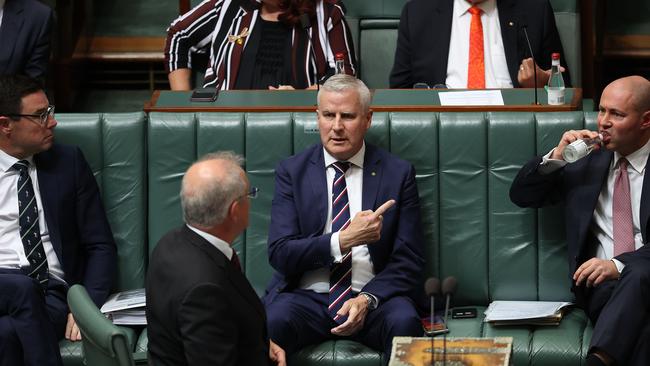 Prime Minister Scott Morrison looks to his deputy Michael McCormack and Treasurer Josh Frydenberg for answers during Time in the House of Representatives yesterday. Picture: NCA NewsWire / Gary Ramage