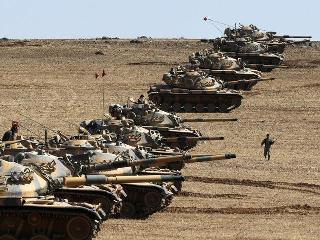 Heavily patrolled border ... Turkish army tanks take up position on the Turkish-Syrian border near the south-eastern town of Suruc, October 2014. Picture: Reuters / Umit Bektas