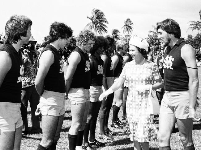 The Queen inspects the St Mary's football team at Gardens Oval. Picture: NT News staff photographer.