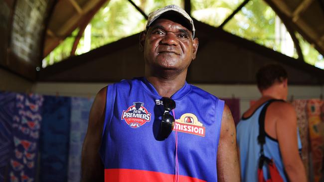 Local Artist Ken Wayne Kantilla showcases some of his art work at the Ngaruwanajjiri Art Market in the Tiwi Islands Picture: Keri Megelus