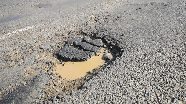 12-6-2012 Hundreds of pot holes line the Lismore to Kyogle road. Photo Doug Eaton / The Northern Star