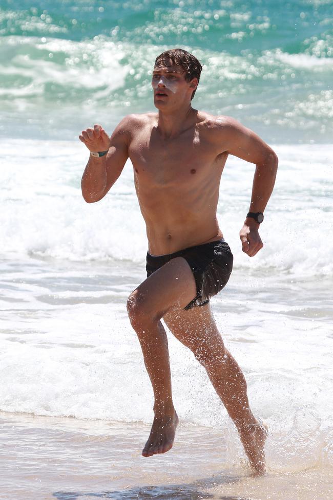 Ethan Reeves running out of the water during the Southport Sharks VFL team’s preseason training camp at Tallebudgera Beach. Picture: Mike Batterham