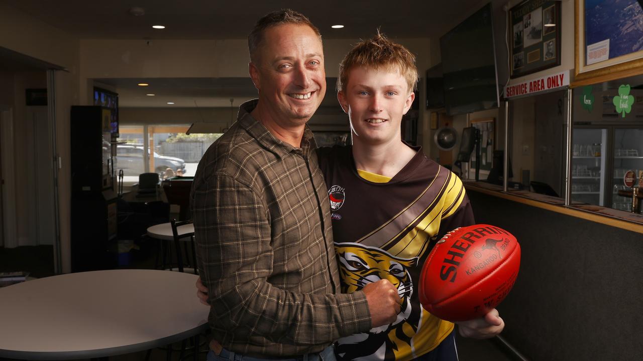 SUN TAS. Grant Pitchford president of the Kingston Beach RSL Club with son Mac Pitchford 16 who plays football with Kingborough Tigers Football Club. Kingston Beach RSL Club is one of the livesites that will host a watch event for the Tasmanian AFL club announcement of it's name and colours. Picture: Nikki Davis-Jones