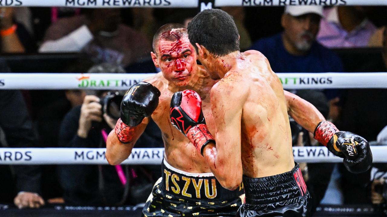 Tim Tszyu (in gold &amp; black short) and Sebastian Fundora (in red &amp; black short) exchange punches during their super welterweight world title fight. (Photo by Getty Images)