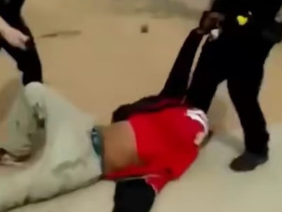 Footage shared to Facebook shows a Port Augusta police officer shoving a man against a wall during an arrest. Picture: Facebook