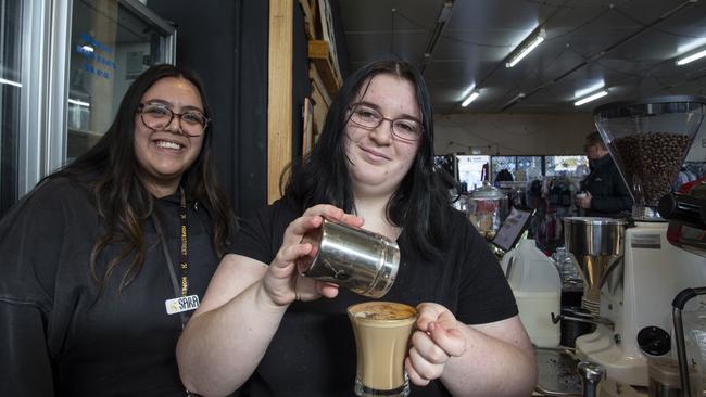 Careworks runs a youth program at its Davoren Park site which includes teaching young people skills such as hospitality and coffee making. Youth Worker Sara Carbone (left) teaches  Volunteer Ash Childs the art of coffee making. 4th July 2024. Picture: Brett Hartwig