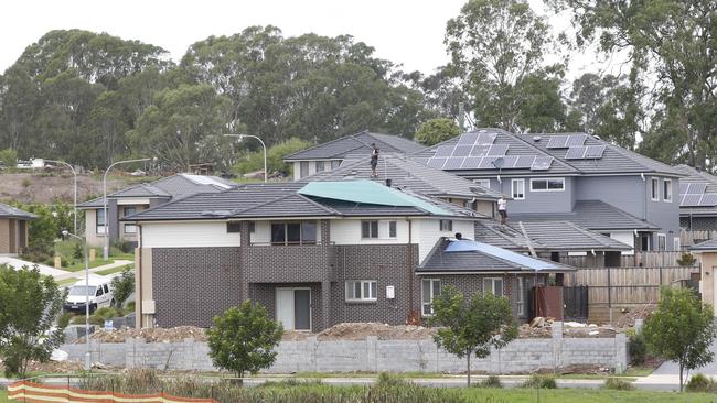 Storm damaged homes in Beaumont Hills covered in tarpaulins after the February storm.