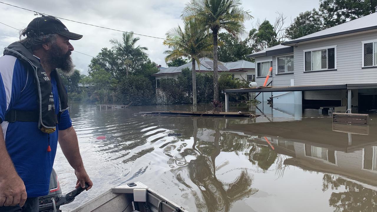 Max Walker checks damage to his Fowler Street home on Tuesday, a day after Lismore was inundated by a record flood.