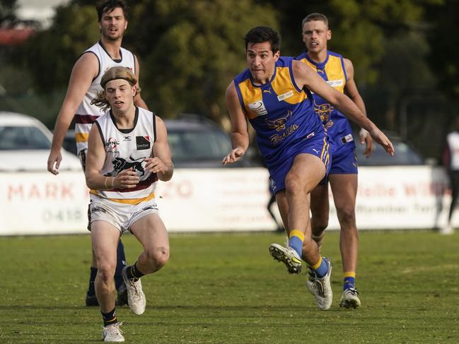 EFNL: Noble Park’s Lachlan McDonnell gets his kick away. Picture: Valeriu Campan