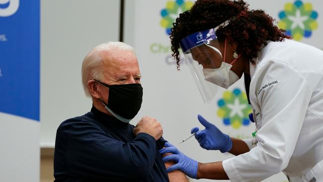 ‘There’s nothing to worry about’: Joe Biden receives the vaccine from nurse practitioner Tabe Mase at Christiana Hospital in Newark on Tuesday. Picture: AFP