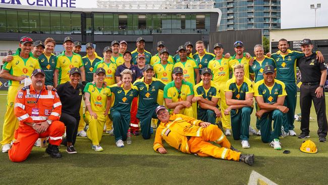 Players from the Ponting XI and the Gilchrist XI pose together after the match.