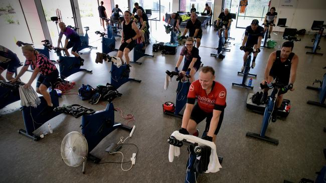 Participants during the Guinness World Record breaking attempt at the longest static indoor spin class at Little Bay, Sydney. Picture: Anthony Gordon