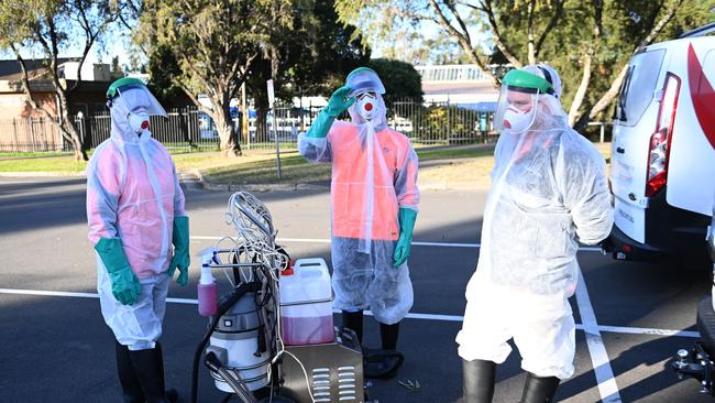 Cleaners prepare to enter an apartment complex in Blacktown at the centre of a Covid cluster. Picture: NCA NewsWire/Jeremy Piper