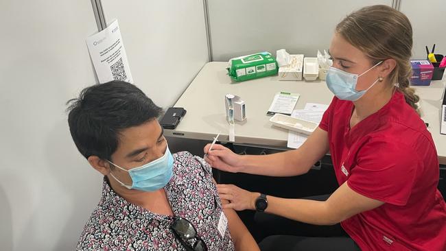 Edwin Edlund receiving his Pfizer jab at the Darwin Covid-19 Vaccination Centre in Marrara. Picture: Thomas Morgan