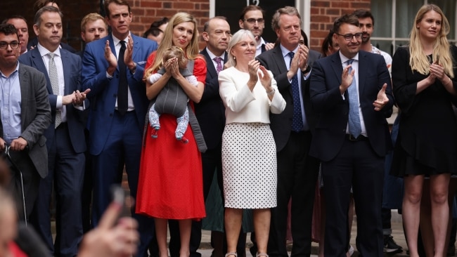 Culture Secretary Nadine Dorries stands beside Carrie Johnson and baby Romy as Prime Minister Boris Johnson addresses the nation to announces his resignation outside 10 Downing Street, on July 7, 2022 in London, England. Photo by Dan Kitwood/Getty Images.