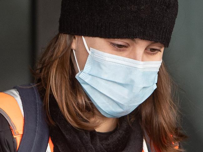 Pictures show a government 'worker' (Dept of Transport I think but she didn't speak very good English) handing out free face masks to people at Bondi Beach on 11th July 2021 as Sydney residents live their lives with the COVID lockdown in NSW. (Pictures by Julian Andrews).