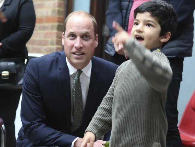 Britain's Prince William, The Duke of Cambridge talks to a child, during his visit to the Al-Manaar Muslim Cultural Centre in London. Picture: AP