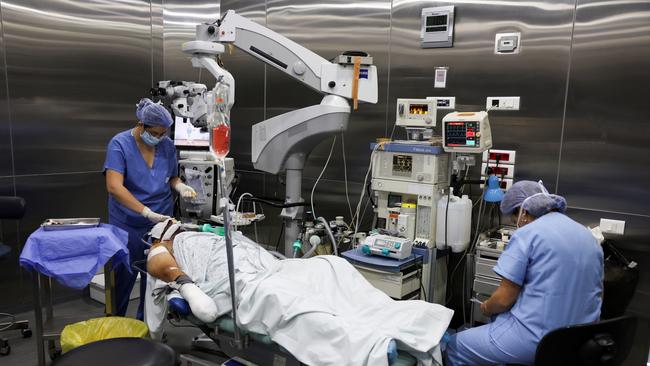 An injured man undergoes an operation, following pager detonations across Lebanon, at a hospital in Beirut on Wednesday. Picture: Reuters