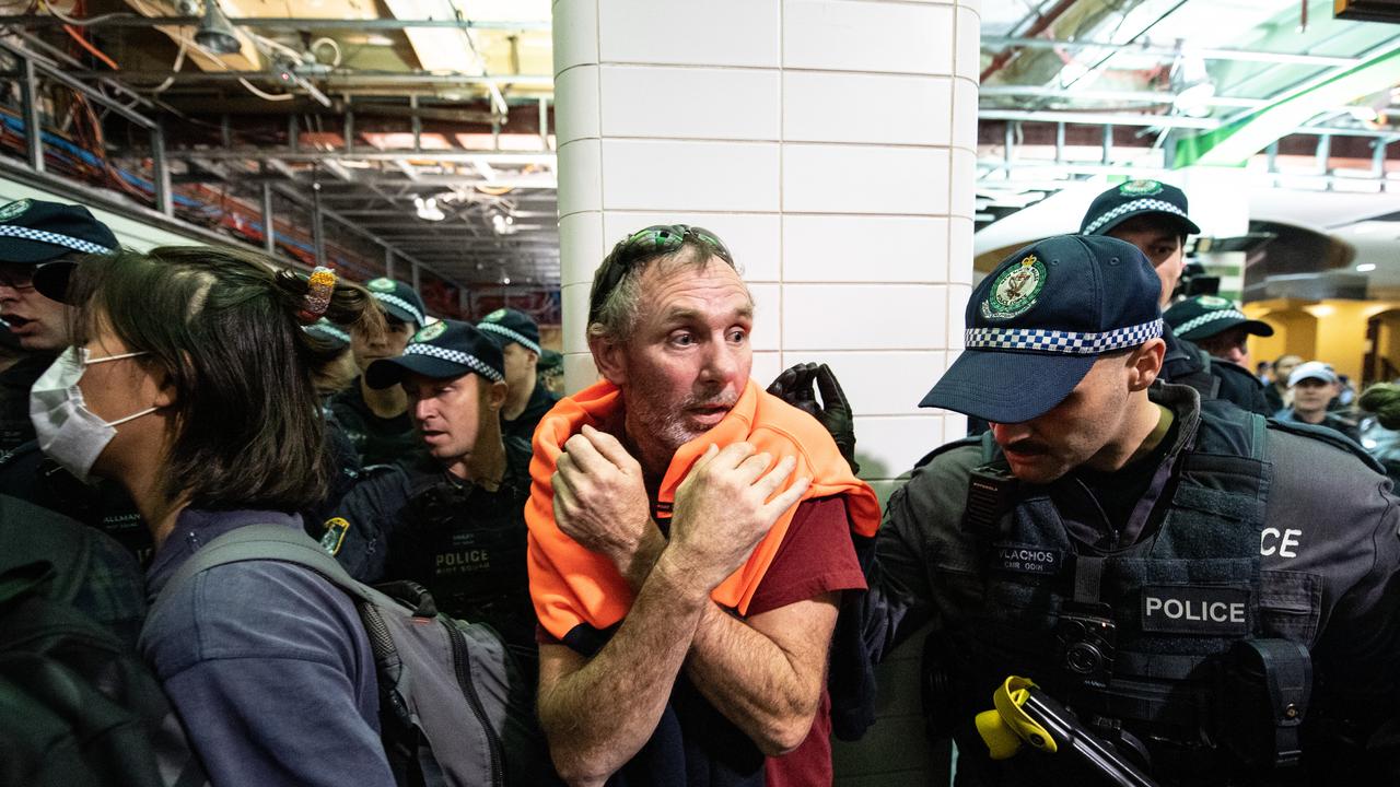 Police clashing with protesters inside Central Station after the rally in Sydney. Picture: AAP/James Gourley