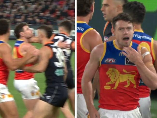 Lachie Neale reacts to being struck by Carlton's Nic Newman.