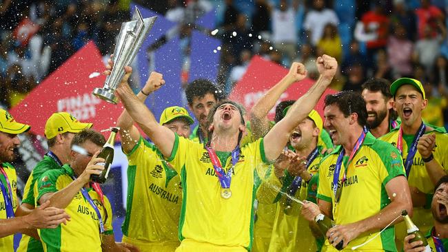 Mitchell Marsh (centre) celebrates with the T20 World Cup trophy and his Australian teammates. Picture: Getty Images