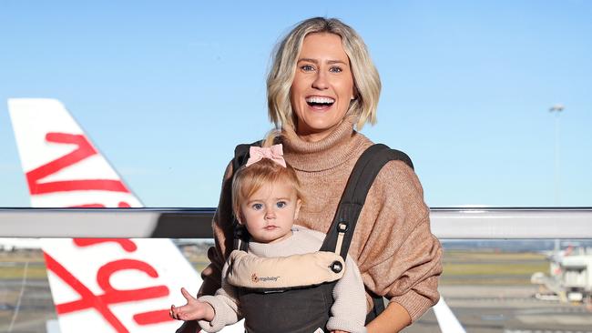 DAILY TELEGRAPH - Pictured at the Virgin Australia Check in at Sydney Domestic Airport today is Julia Carroll with her 1 year old daughter Aurora, who is excited to be travelling again. Picture: Tim Hunter.