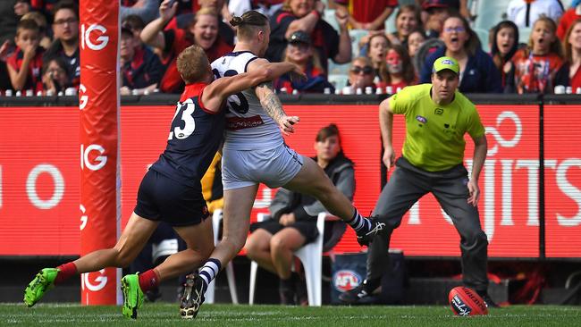 Cam McCarthy gets a toe on the ball to kick the winning goal. Picture: AAP