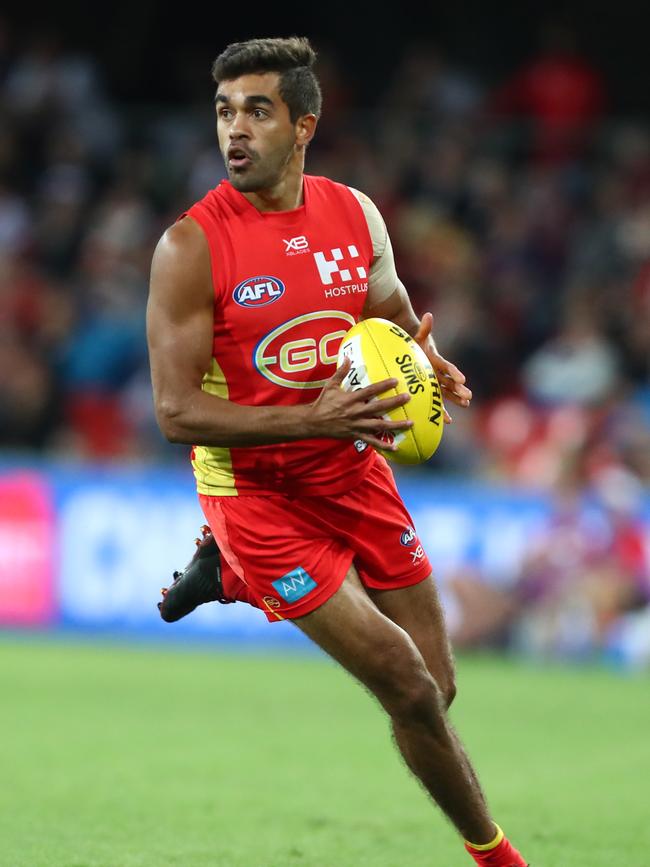 Jack Martin of the Suns runs the ball during the round eight AFL match between the Gold Coast Suns and the Melbourne Demons at Metricon Stadium on May 11, 2019 in Gold Coast, Australia. (Photo by Chris Hyde/Getty Images)