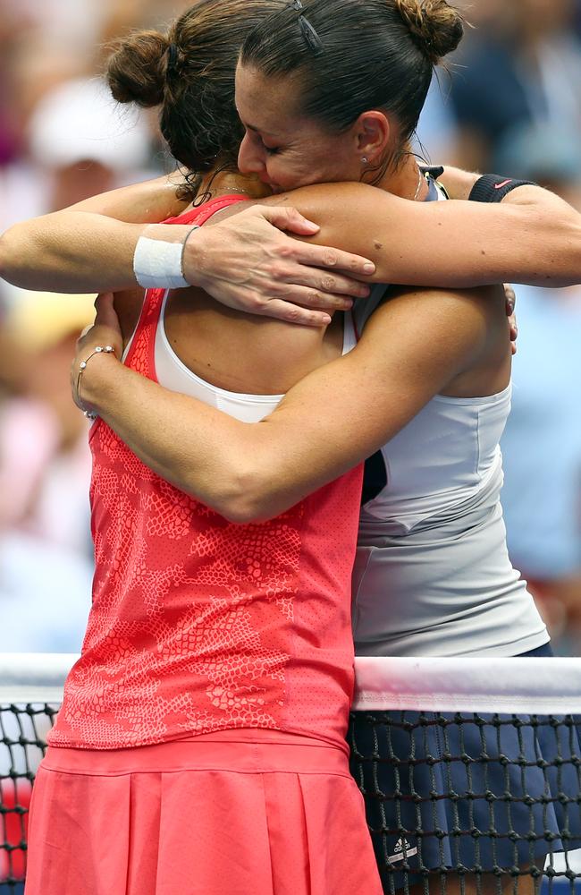 Good friends Flavia Pennetta and Roberta Vinci embrace after their final showdown.