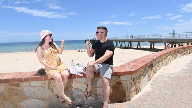 Locals Chloe Jones and Christian Tassone enjoy lunch at Glenelg. Picture: Keryn Stevens