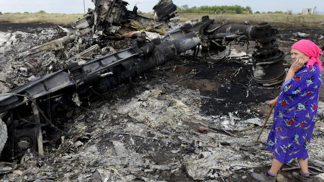 A local resident stands among the wreckage. Picture: AFP