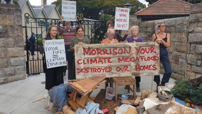 Lismore flood survivors have delivered a powerful message at the front gates of Scott Morrison's Sydney residence. Picture: NCA NewsWire / Damian Shaw