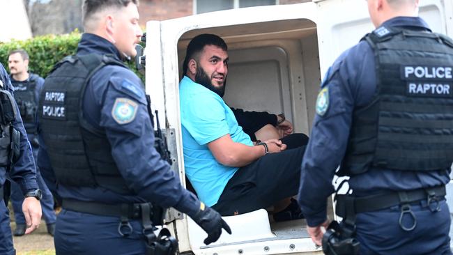 Ali Elmoubayed still had time for a laugh during his arrest, asking The Daily Telegraph’s reporter: “You going to be on TikTok today?”. Picture: Jeremy Piper